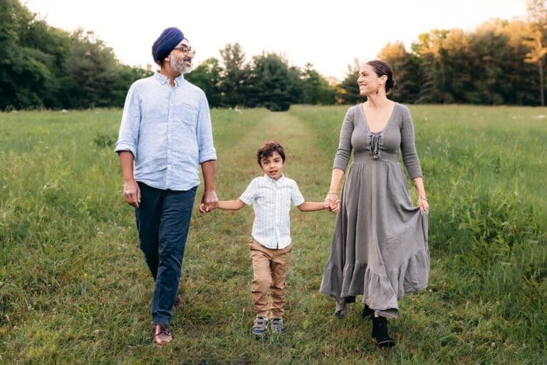 The loving family explores Schwartz Peony Garden in May at Seneca Creek State Park, capturing tender moments and laughter.