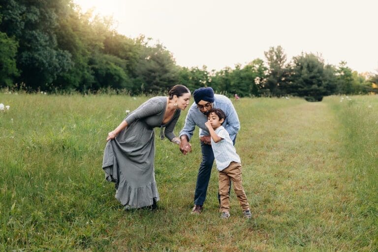 Amidst the lush beauty of Schwartz Peony Garden, a happy family bonds, making wishes as they blow the seeds of dandelions into the air.