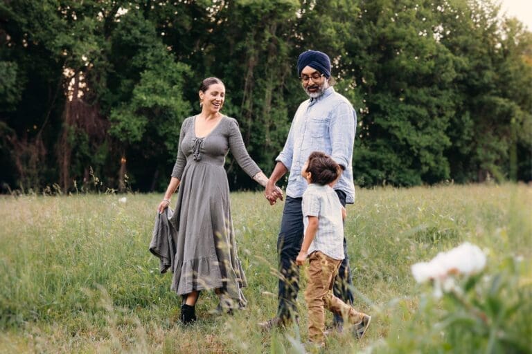 A beautiful family walk in Schwartz Peony Garden—mom, dad, and their adorable 3-year-old boy enjoying nature and playtime.